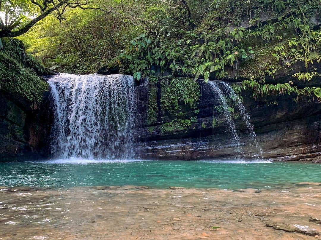 The hot weather draws people to cool off in the creek.